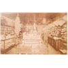 Image 2 : ANTIQUE MOUNTED PHOTO OF THE INSIDE OF A GENERAL STORE