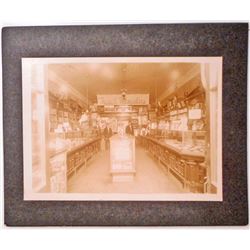 ANTIQUE MOUNTED PHOTO OF THE INSIDE OF A DRUG STORE