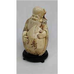 A bone carving of Longevity God figure