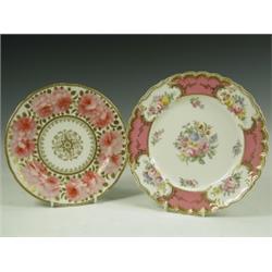 Two plates: one Coalport, painted with reserved coloured flower bouquets and a pink and gilt b...