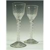 Image 1 : Two 18th Century cordial glasses with panelled bowls on opaque twist stems, the feet probably...