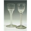 Image 1 : Two 18th Century wine glasses with panelled ogee bowls on double strand opaque twist stems, ch...