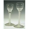 Image 1 : Two 18th Century cordial glasses with panelled ogee bowls on double strand opaque twist stems,...