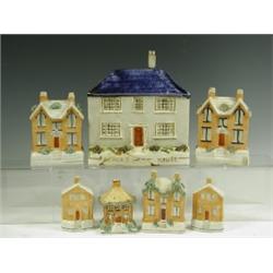 Six Victorian Staffordshire house money boxes, tallest 13cm, various damage, and a model of 'P...