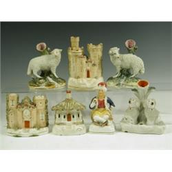 Two Staffordshire sheep, two castles, a cottage, a pair of poodles and a Turk, various damage...