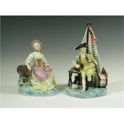 A pair of French porcelain figures of an officer and his wife drinking on a green base, with p...