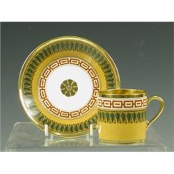 An early 19th Century Sevres cabinet cup and saucer painted with bands of 'Greek key' and 'pal...