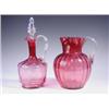 Image 1 : A Victorian cranberry glass jug and decanter, 18cm and 26cm respectively. Est. 100/150...