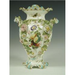 An English porcelain vase, possibly Coalport, decorated with floral sprigwork, painted with fr...