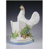 Image 1 : A 19th Century porcelain model of a chicken beside a spill holder with foliage, upon an oval b...