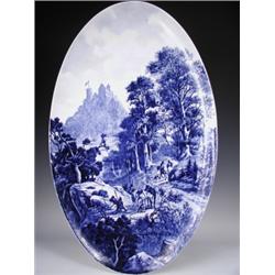 A large late l9th Century Austrian oval blue and white wall plaque, decorated with a hill top...