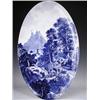 A large late l9th Century Austrian oval blue and white wall plaque, decorated with a hill top...