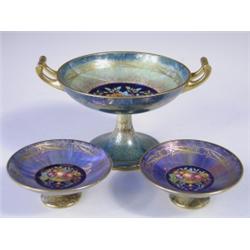 A trio of late l9th Century Minton porcelain pedestal bowls, each decorated with a polychrome...