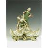Image 1 : A 1920s Royal Dux style figure depicting two figures above shell shaped bowls, arms restored,...