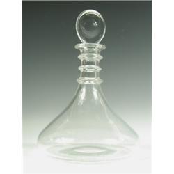 An early 19th Century ship's decanter, in the Rodney shape, with a triple ring neck, wide tape...