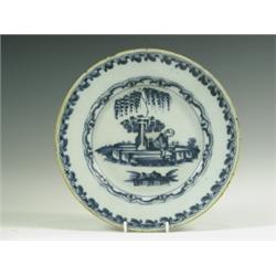 An 18th Century delft plate decorated with an chinoiserie figure under a tree, possibly Lambet...