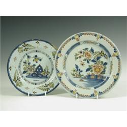 Two mid 18th Century delft plates decorated in polychrome, with flowers and trellis, Lambeth,...