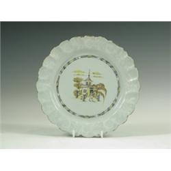 A mid 18th Century Bristol Bianco-Sopra-Bianco decorated delft plate, the centre decorated in...