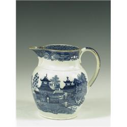 An early 19th Century Swansea blue and white pearlware jug, with a printed willow pattern, res...