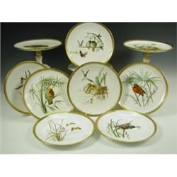 A Mintons dessert set comprising two tall comports, three low comports and twelve plates, each...