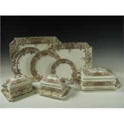 A Victorian Aesthetic pottery dinner service in the Alexandria pattern, comprising 3 graduated...