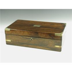 A Victorian rosewood and brass bound writing slope, opening to reveal a leather surface and tw...