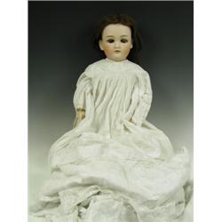 A Simon & Halbig bisque head doll with a wooden and composition body, impressed, '1349...S & H...