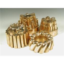 Four Victorian copper jelly moulds of various shapes, two with Benham & Froud stamps, one mark...