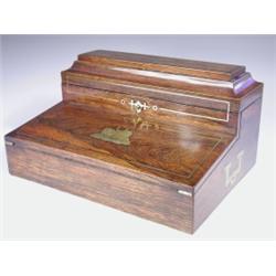 A late Regency rosewood writing slope, having inlaid brass stringing, inset to the front slope...