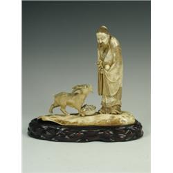 A Japanese ivory figure of an immortal with a goat, c.1900, signed Gyo Kushin, 20.5cm high ...