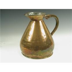 A 19th Century copper two gallon measure of waisted bulbous form, having a flared lip and appl...