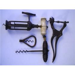 Four 19th Century corkscrews including a Kings screw type four pillar corkscrew with a bone ha...