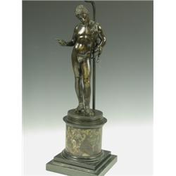 A late 19th Century bronze figure 'Narcissus' on a circular base with a variegated veined marb...