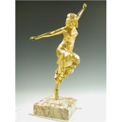 An early 20th Century gilt bronze figure of a female leaning forward with arms outstretched, (...