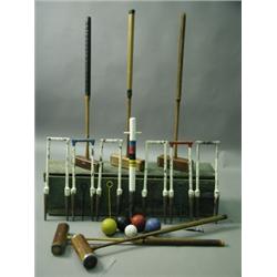 A 20th Century boxed croquet set, comprising of four Jaques of London mallets and one other, s...