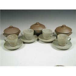 Eight studio pottery coffee cups and saucers, a matching sugar bowl and eight lidded soup bowl...