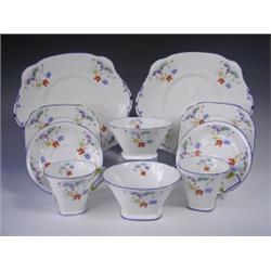 An Art Deco Standard china Cromer shape twelve place tea set, with printed and enamel floral d...