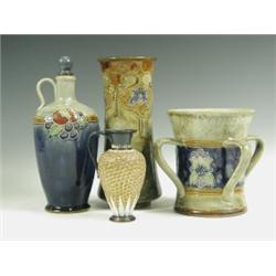 Three pieces of Royal Doulton stoneware, a tyg, a bottle and stopper and a Doulton Lambeth jug...