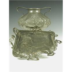 An Art Nouveau period pewter tray with a stylised female and floral decoration, an four bun fe...