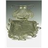 An Art Nouveau period pewter tray with a stylised female and floral decoration, an four bun fe...
