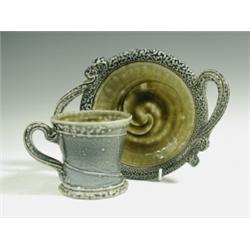 A studio pottery mottled stoneware cup and saucer, by Wally Keeler, 9cm high Est. 60/80...