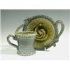Image 1 : A studio pottery mottled stoneware cup and saucer, by Wally Keeler, 9cm high Est. 60/80...