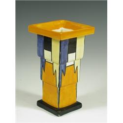 A Clarice Cliff Bizarre stepped vase, shape 369A, in geometric patterns of blue, yellow, black...