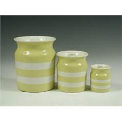 Three T G Green yellow Cornishware storage jars and covers, printed marks, 18cm highest Est...