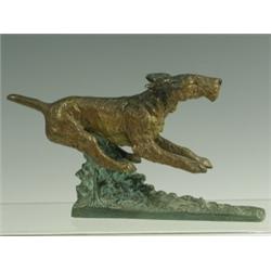 An early 20th Century cold painted bronze of a leaping terrier, K Salat, 19cm long, 10.5cm hig...