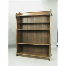 An Arts & Crafts walnut open bookcase with adjustable shelves and panelled sides, 1.4m wide x...