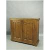 Image 1 : An Arts & Crafts oak two door cupboard with visible ebonised tenons, having two double panelle...