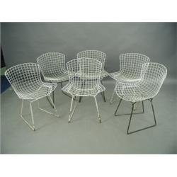 In the style of Harry Bertoia, six 'Chickenwire' chairs with a white painted finish Est. 12...