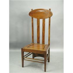 A mahogany (?) high back single chair in the style of a Charles Rennie Mackintosh design for t...