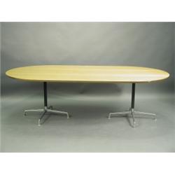 A 1970s oak veneered boardroom table, raised on two cast aluminium stands, 240cm x 124cm wide<...
